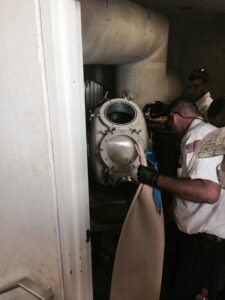Plumber performing CIPP trenchless sewer repair