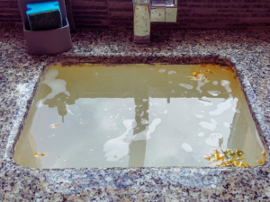 clogged sink with standing water
