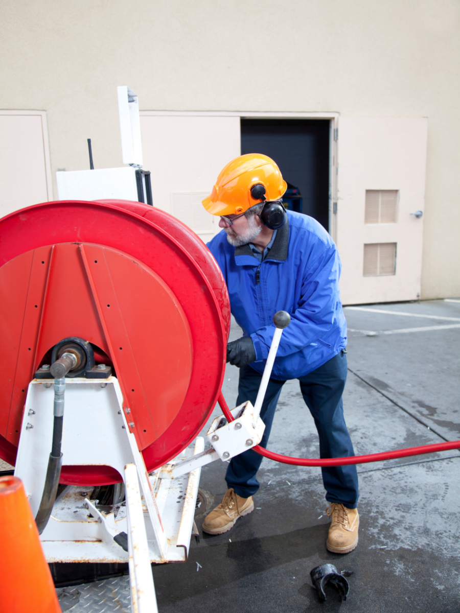 Plumber getting ready to hydro jet sewer line