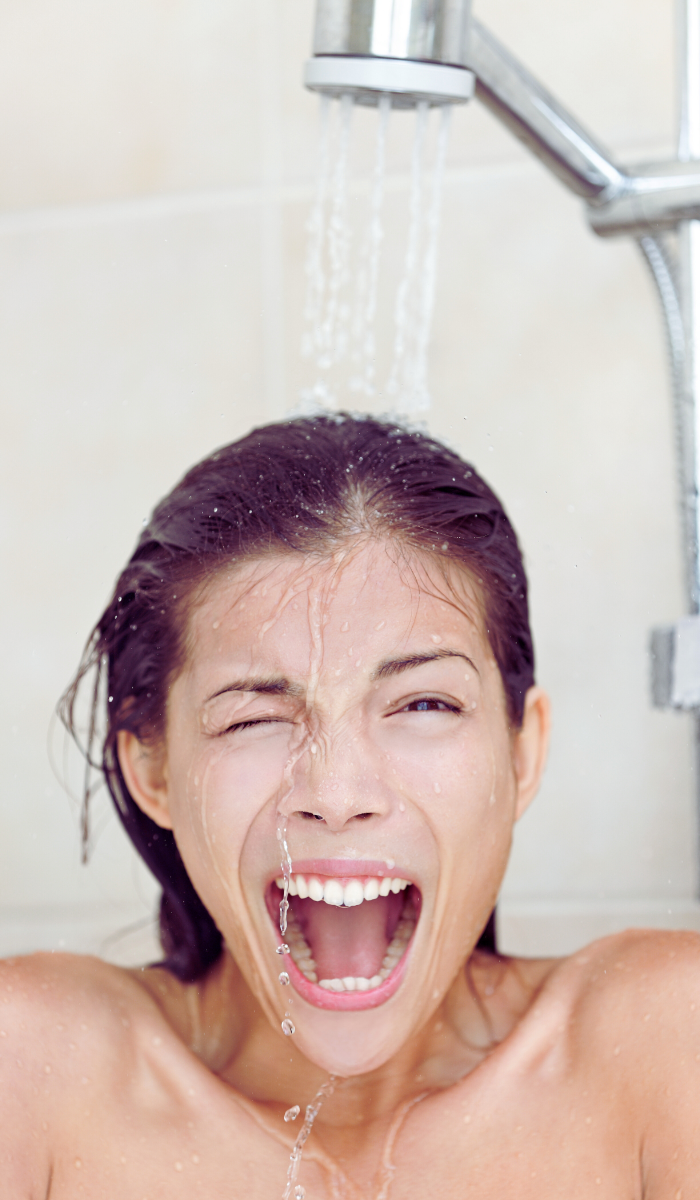 woman experiencing cold shower because water heater is not working